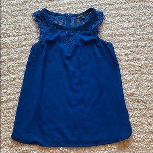 Bright blue sleeveless blouse